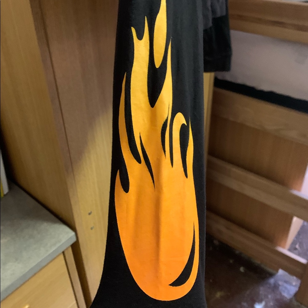 Long sleeve crop top, fire design up sleeves.